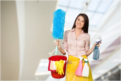 Local cleaners preparing a rented flat for handover in E1