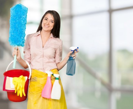 Office cleaning service preparing desks and meeting rooms in E1